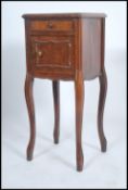 A 19th century French marble bedside cabinet havin