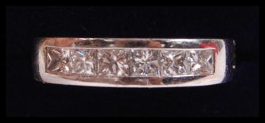 An 18ct white gold and diamond ladies half eternit