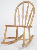 A vintage mid century Ercol beech and elm rocking
