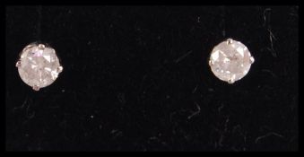 A good pair of white gold and diamond ear studs, a