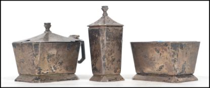 A silver hallmarked table cruets / salt set to include a table salt and lidded mustard pot