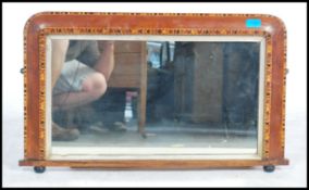 A Victorian 19th century marquetry inlaid tunbridge framed mirror raised on ebonised bun feet with