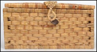 A collection of vintage artist paint, brushes and equipment all contained within a vintage wicker