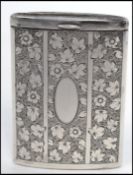 A vintage silver sliding vesta case having a chased floral decoration with bands and a plain