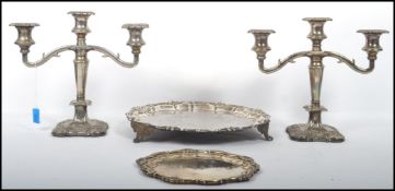 A collection of silver plate to include Mappin & Webb table candelabra along with good quality
