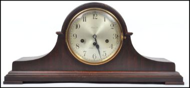 A good quality Victorian style beech wood country rocking chair having shaped elbow rests with large