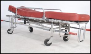 A mid century retro / industrial medical ambulance bed trolley. Tubular metal construction with