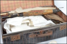 A collection of vintage 20th century items to include a vintage leather travel case, a good