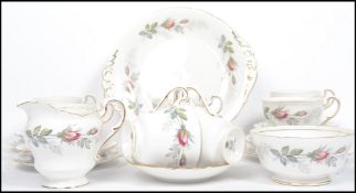 A vintage 20th century Paragon floral tea set in the Bridal Rose pattern consisting of six cups,