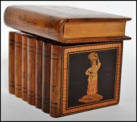 A 19th century olivewood sorrento ware inlaid box in the form a stack of books having cartouche
