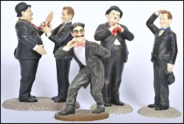 A group of 1930s / 40s film memorabilia TV stars figurines to include a Laurel and Hardy figurine