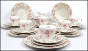 A Royal Doulton tea and dinner service decorated in the Woodland Rose pattern TC1123 consisting of