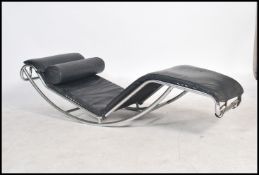 After Le Corbusier LC4 chaise lounge day bed with black leather upholstery and barrel cushion set