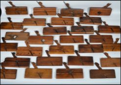 A large collection of vintage 20th century woodworking moulding planes to include a left and right