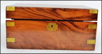 A 19th century Victorian walnut writing slope having a dual barrel lock with brass edge work ,