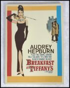 A vintage reproduction cinema film advertising poster for Breakfast at Tiffany's featuring the