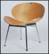 A 20th Century bent plywood easy lounge chair raised on tubular chrome legs in the manner of