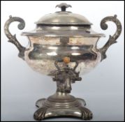 A large 20th century silver pated samovar of bulbous form complete with the lid, tap and having twin