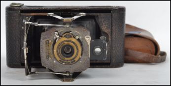 A vintage early 20th century Kodak 1A folding bellows camera complete in original Kodak case.