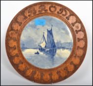 A vintage possibly 1930's carved oak bread board of believed German origin having a central recessed