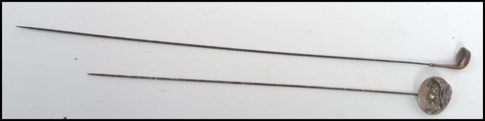 Two vintage 20th century sterling silver hat pins one in the form of a golf club being hallmarked