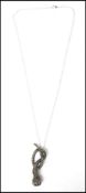A 20th century ladies contemporary silver and marcasite adorned snake necklace pendant complete with
