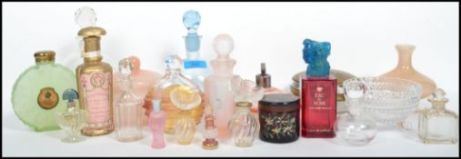 A good collection of vintage and retro perfume bottles of varying designs dating from the early 20th