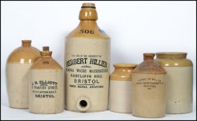 A good group of vintage 20th century advertising breweriana stoneware cider flagons and storage jars