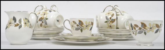 A Wedgwood Bone China seven person tea service in a floral design, to include cups, saucers.