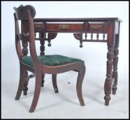 An Edwardian mahogany writing table desk being raised on turned legs united by stretchers having