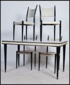 E. Gomme G-Plan - A set of four mid century ebonised ladder back dining chairs in the manner of