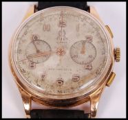 A vintage mid century Titus, Geneve gentleman`s 18ct / 750  gold chronograph wristwatch. The watch