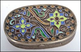 A possible Russian enamel and silver white metal snuff  / pill pot, fitted with a hinged enamel