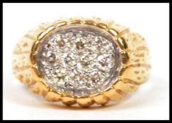 A 20th century yellow gold gentlemans diamond ring adorned with approx 1ct of diamonds complete in