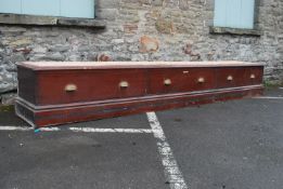 A 19th century large mahogany shop display cabinet - museum cabinet base raised on a plinth base