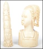 An early 20th century Ivory carved icon together with an African bust of a nomadic woman. Both