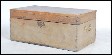 A vintage early 20th century pine work box with a fitted hinged top raised on a plinth base.