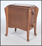 An inlaid work / sewing box having shaped legs, the box with a hinged lid and various compartments