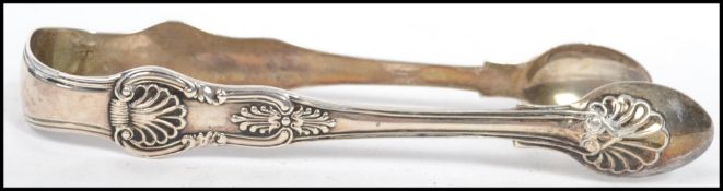A pair of large Georgian silver hallmarked sugar tongs, having assay mark for xxxxxxx