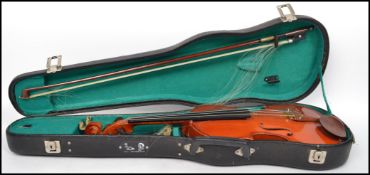 A vintage Stentor student violin and bow with label to interior complete in original case.