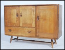 A mid century Ercol Windsor pattern sideboard dresser. Light elm and beech sideboard, double doors