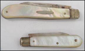 Two silver hallmarked mother of pearl handled fruit pen knives one being hallmarked for Birmingham