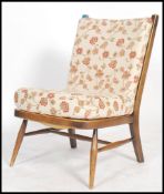 An Ercol ' Windsor ' pattern beech wood open framed chair - armchair. Raised on turned legs with