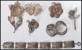 A collection of vintage silver filigree jewellery to include bracelet, brooches, pendant etc