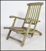 A vintage 20th century teak metamorphic folding chair lounger with label for Firman Leisure