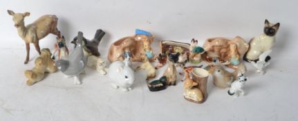 A collection of ceramic animals to include a Beswick Reindeer, Hornsea, SylvaC, USSR etc. Please see