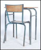A school desk of French origin having tubular metal frame, dating to the 1970's together with a