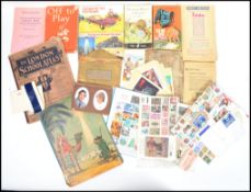 A good collection of mixed ephemera to include various world stamps, fold out maps and atlas's,