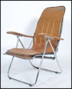 A 1970's brown vinyl and tubular metal deck char with Mod - Metal Mfar engraved to the underside