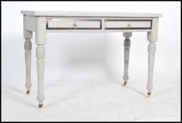 A 20th century shabby chic upcycled Edwardian painted writing table desk having applied mosaic style